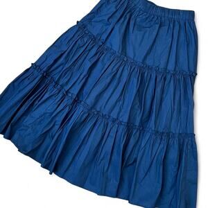 Navy blue maxi skirt with multiple small ruffle tiers and elastic wasitband